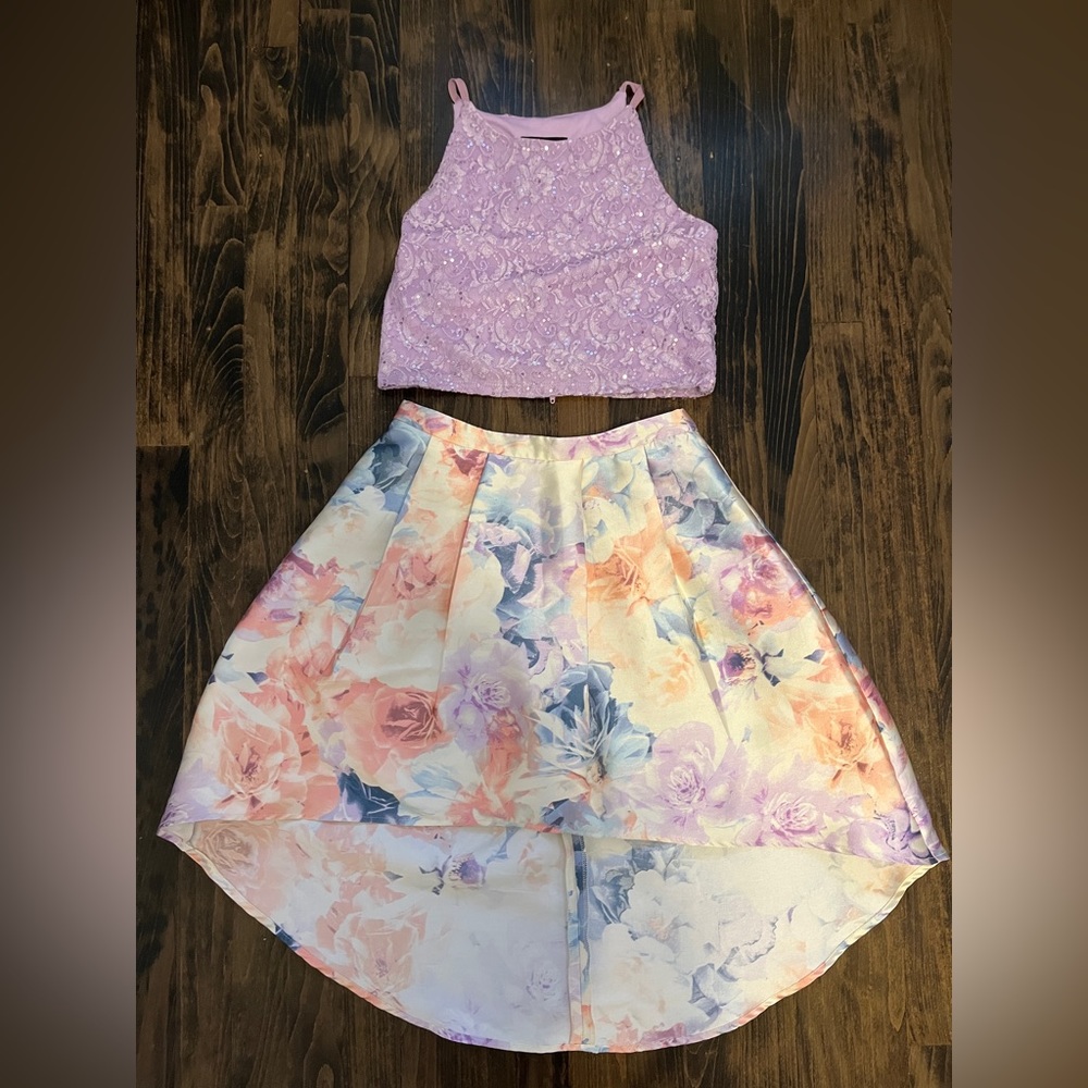 2 piece spaghetti strap purple tank and floral skirt set. Size 14 in kids.